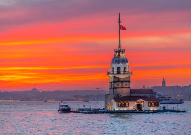 Istanbul, Turkey. Sunset over Bosphorus with famous Maiden's Tower (Kiz Kulesi) symbol of Istanbul, Turkey. Scenic travel background.