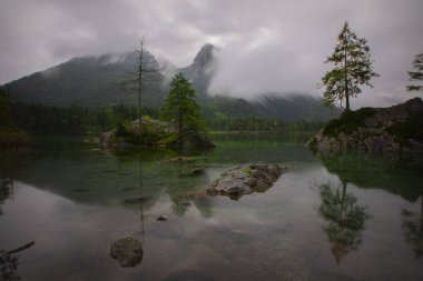 Hintersee, Bavaria. Wonderful autumn sunset of Hintersee lake. Amazing sunlgiht view of Bavarian Alps, Germany, Europe. Beauty of nature concept background.