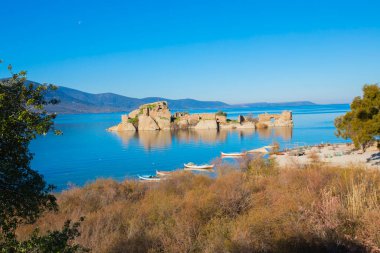Bafa lake is a peaceful place, ringed by traditional villages such as Kapkr full of fisherman boats and ruins of Herakleia