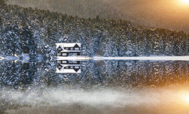 Lake wooden house on a snowy winter day in the forest in Bolu Glck National Park, Turkey , Panorama shot
