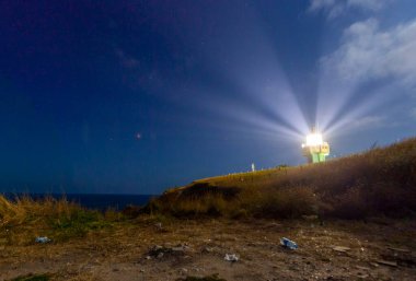 Karaburun harbor and Karaburun lighthouse, night star photography and astrophotography
