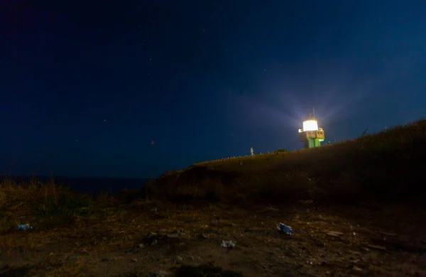 Karaburun harbor and Karaburun lighthouse, night star photography and astrophotography