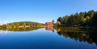 Golcuk National Park Bolu Turkey. Autumn wooden Lake house inside forest in Bolu Golcuk National Park, Turkey