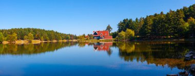 Golcuk National Park Bolu Turkey. Autumn wooden Lake house inside forest in Bolu Golcuk National Park, Turkey