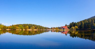 Golcuk National Park Bolu Turkey. Autumn wooden Lake house inside forest in Bolu Golcuk National Park, Turkey