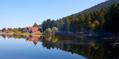 Golcuk National Park Bolu Turkey. Autumn wooden Lake house inside forest in Bolu Golcuk National Park, Turkey