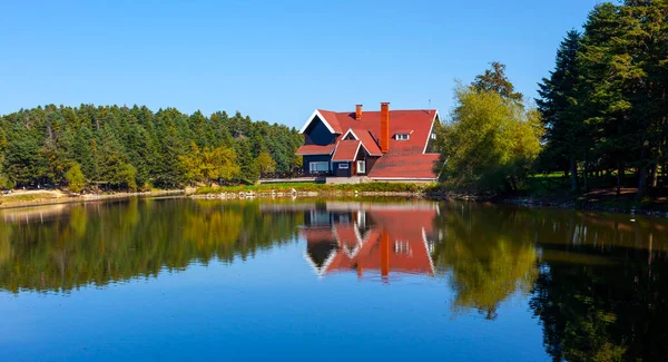 Golcuk National Park Bolu Turkey. Autumn wooden Lake house inside forest in Bolu Golcuk National Park, Turkey
