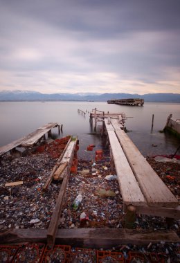A collection of old piers was photographed using the long exposure technique