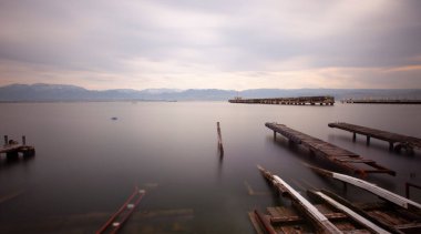 A collection of old piers was photographed using the long exposure technique