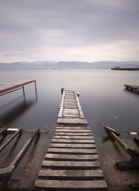 A collection of old piers was photographed using the long exposure technique