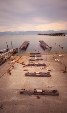 A collection of old piers was photographed using the long exposure technique