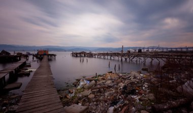 A collection of old piers was photographed using the long exposure technique