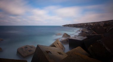 Fantastic photos taken with panorama long exposure technique in a wavy harbor