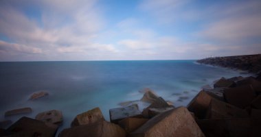 Fantastic photos taken with panorama long exposure technique in a wavy harbor