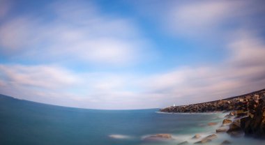 Fantastic photos taken with panorama long exposure technique in a wavy harbor