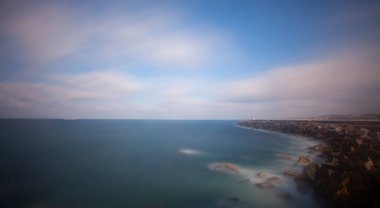 Fantastic photos taken with panorama long exposure technique in a wavy harbor