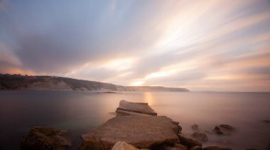 Fantastic photos taken with panorama long exposure technique in a wavy harbor