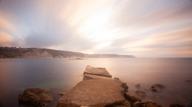 Fantastic photos taken with panorama long exposure technique in a wavy harbor
