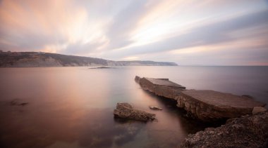 Fantastic photos taken with panorama long exposure technique in a wavy harbor