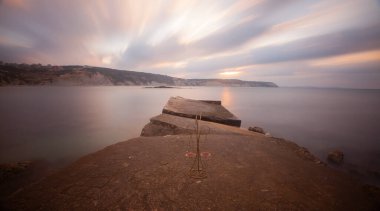 Fantastic photos taken with panorama long exposure technique in a wavy harbor