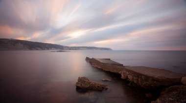 Fantastic photos taken with panorama long exposure technique in a wavy harbor