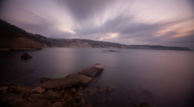 Fantastic photos taken with panorama long exposure technique in a wavy harbor