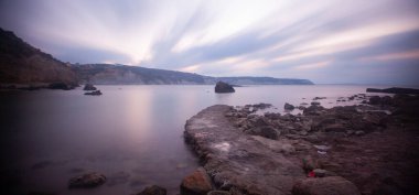 Fantastic photos taken with panorama long exposure technique in a wavy harbor