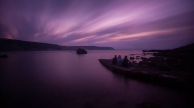 Fantastic photos taken with panorama long exposure technique in a wavy harbor