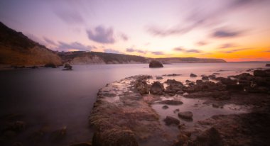 Photos taken with big rocks and long exposure technique at sunset