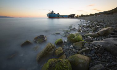 An old ship washed ashore from the sea