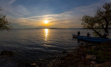 Fishing boats and net fisherman throwing into the lake, Lake Eber, Afyonkarahisar