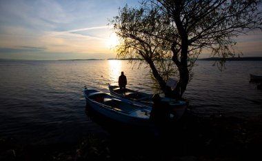 Fishing boats and net fisherman throwing into the lake, Lake Eber, Afyonkarahisar