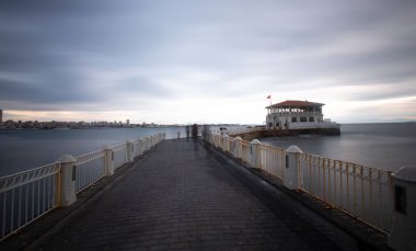  Historical Moda Pier building jutting out into the Sea of Marmara in Kadikoy neighborhood of Istanbul.