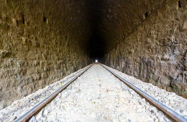 A railroad tunnel with a light at the end. Can represent achieving your goals, getting through problems and obstacles or simply represent exactly what you can see - an old tunnel.