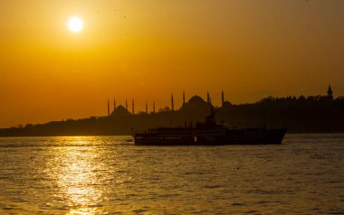 Blue Mosque and Hagia Sophia , Wonderful Istanbul view at sunset, sun dancing between minarets