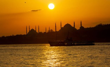 Blue Mosque and Hagia Sophia , Wonderful Istanbul view at sunset, sun dancing between minarets