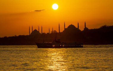 Blue Mosque and Hagia Sophia , Wonderful Istanbul view at sunset, sun dancing between minarets