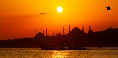 Blue Mosque and Hagia Sophia , Wonderful Istanbul view at sunset, sun dancing between minarets