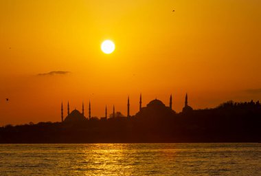 Blue Mosque and Hagia Sophia , Wonderful Istanbul view at sunset, sun dancing between minarets