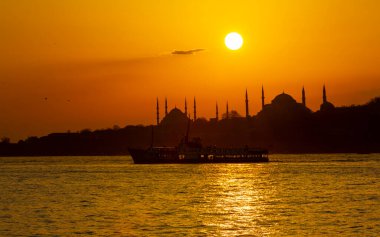 Blue Mosque and Hagia Sophia , Wonderful Istanbul view at sunset, sun dancing between minarets