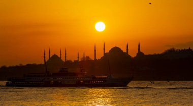 Blue Mosque and Hagia Sophia , Wonderful Istanbul view at sunset, sun dancing between minarets
