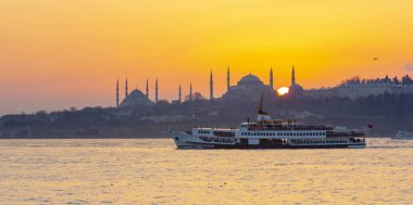 Blue Mosque and Hagia Sophia , Wonderful Istanbul view at sunset, sun dancing between minarets