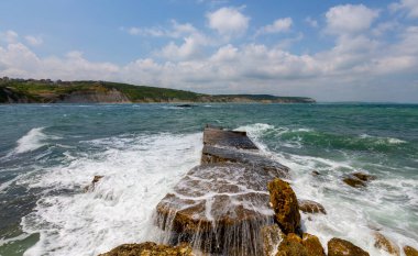 Gerzede basalt cliffs harbor area photographed with long exposure technique.