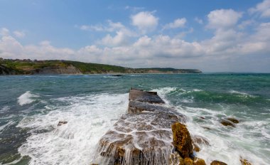 Gerzede basalt cliffs harbor area photographed with long exposure technique.