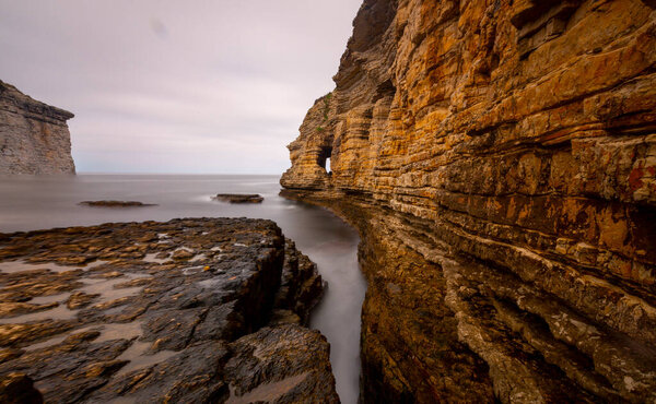 Dramatik sunset view on the cliff shapes. Colourful sea shapes image. Giant rocks on the sea. Eagle rocks of Kerpe. Kerpe, Kocaeli, Turkey.