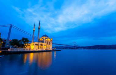 Istanbul. Image of Ortakoy Mosque with Bosphorus Bridge in Istanbul during beautiful sunrise.
