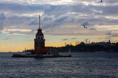 Istanbul, Turkey. Sunset over Bosphorus with famous Maiden's Tower (Kiz Kulesi) symbol of Istanbul, Turkey. Scenic travel background.