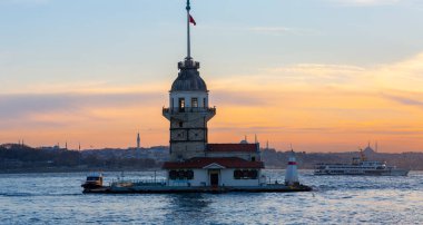 Istanbul, Turkey. Sunset over Bosphorus with famous Maiden's Tower (Kiz Kulesi) symbol of Istanbul, Turkey. Scenic travel background.