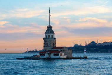 Istanbul, Turkey. Sunset over Bosphorus with famous Maiden's Tower (Kiz Kulesi) symbol of Istanbul, Turkey. Scenic travel background.