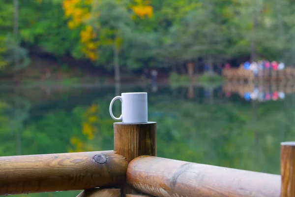 Autumn and coffee mug .